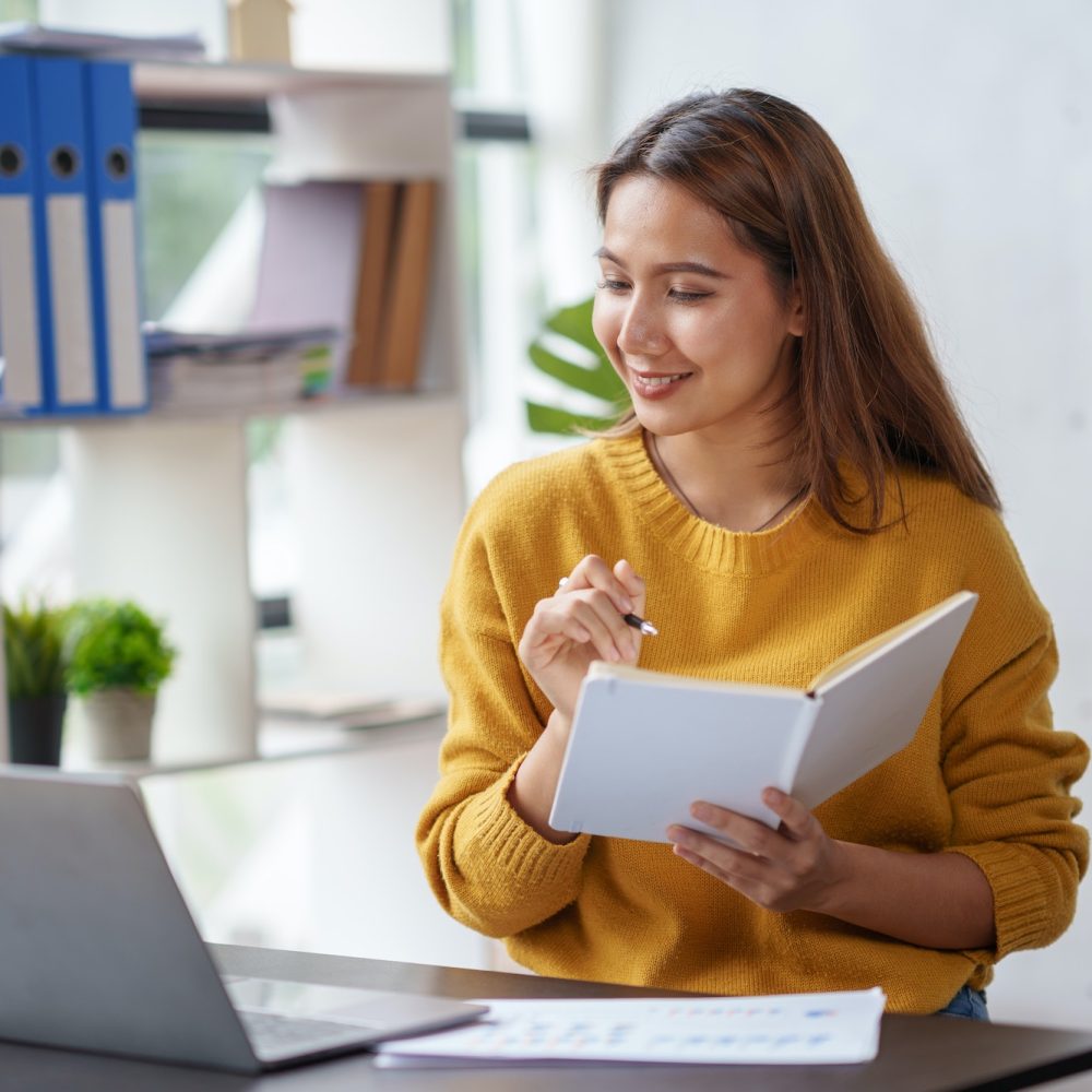 beautiful-young-asian-business-woman-working-on-her-laptop-enjoy-smiling-and-happy-working-taking-n.jpg